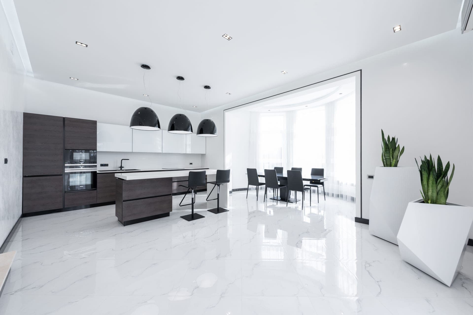 White planters displayed on a wall in a bright kitchen